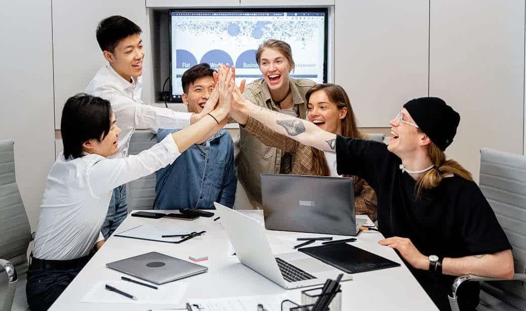 Diverse team celebrating successful recruit in Latin America